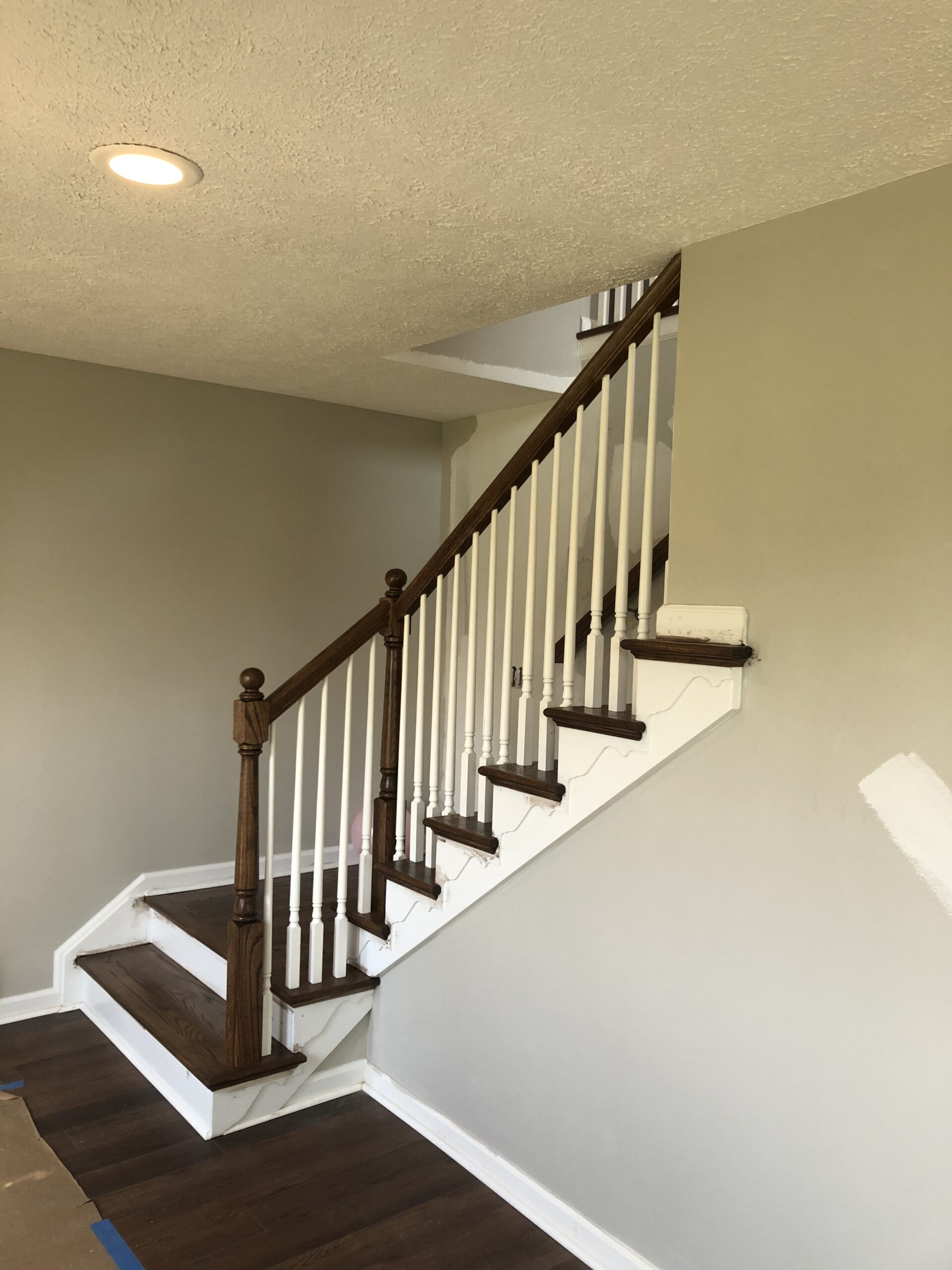 Beautifully designed and built compact stairway provides game room access