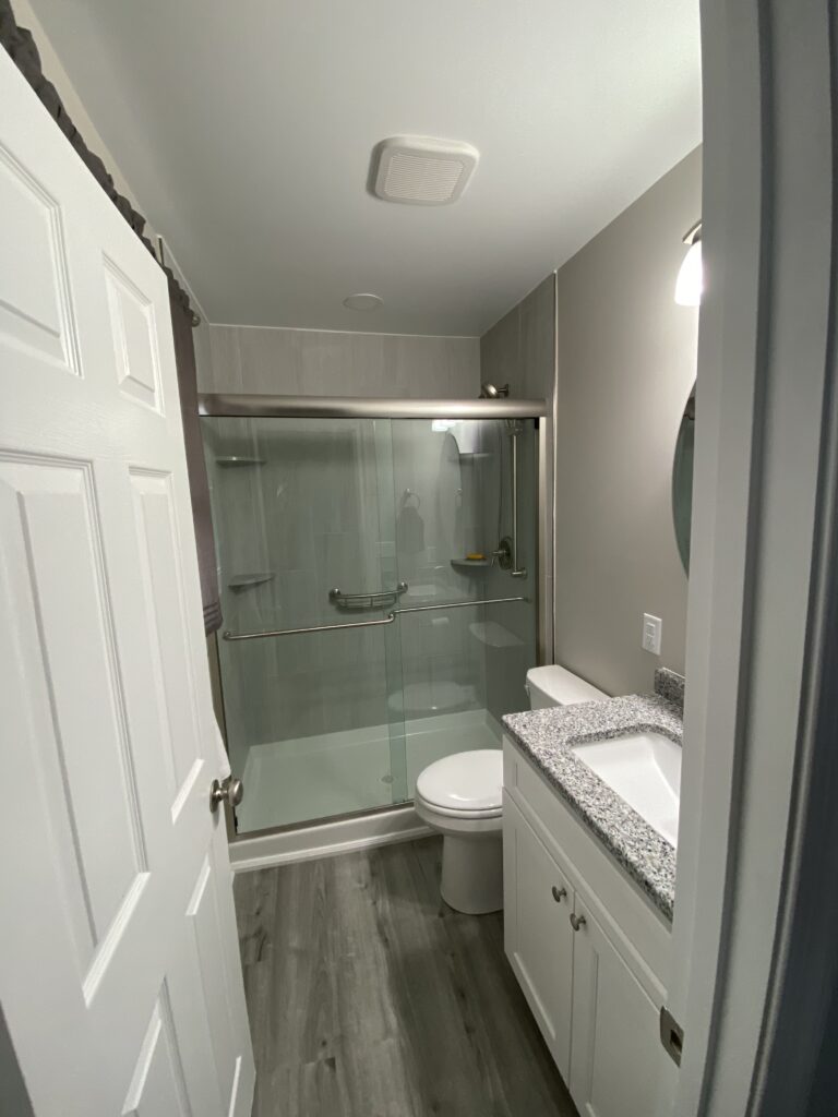 Another beautiful bathroom renovation, converting a traditional bathtub into a luxury shower stall.