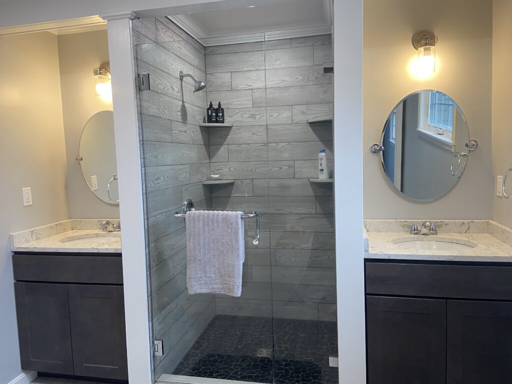 luxury shower stall between his and hers sinks